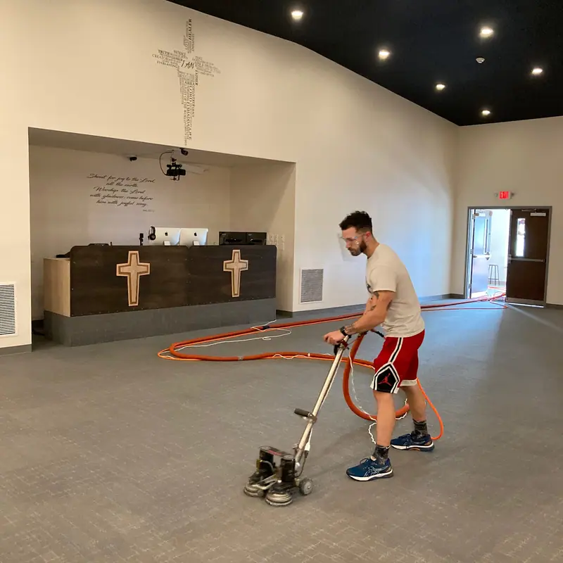 Technician cleaning the carpet of a church sanctuary with the Rotovac